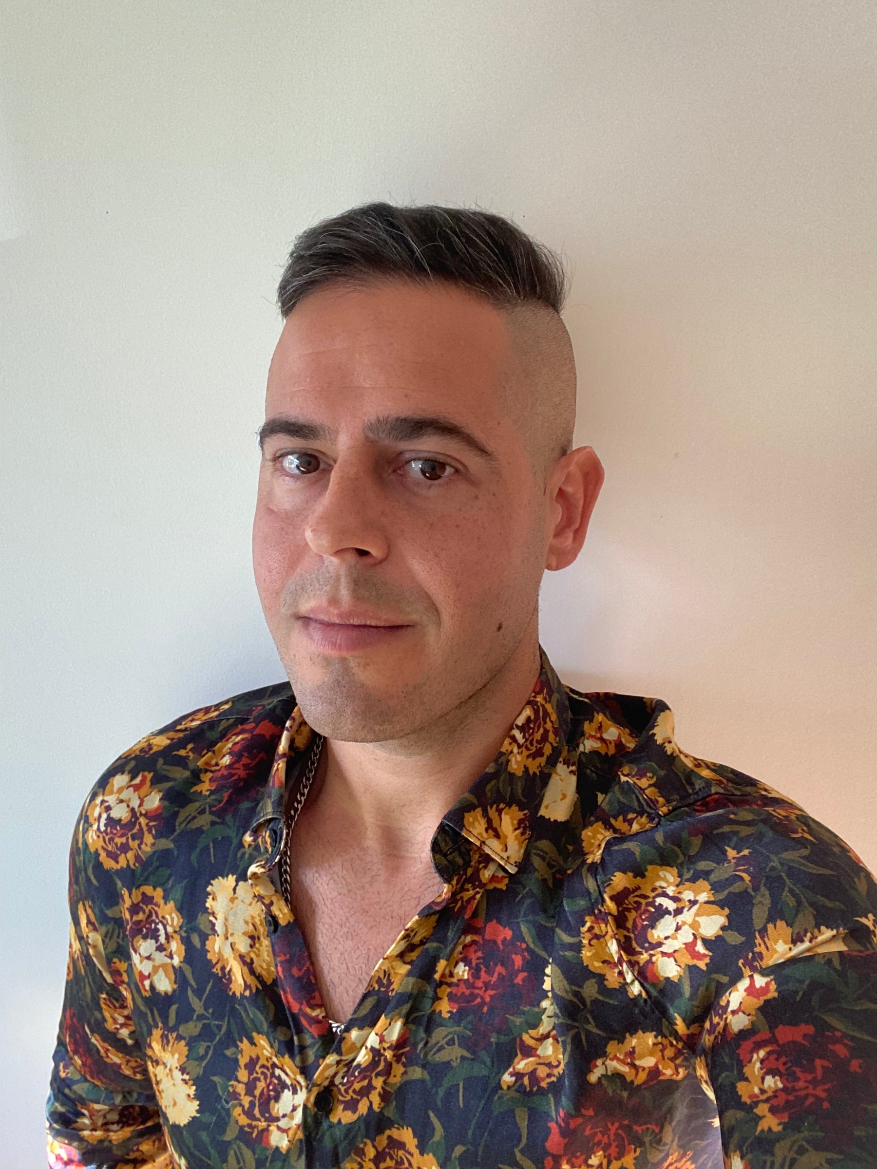 Jon Riesel in a floral shirt portrait
