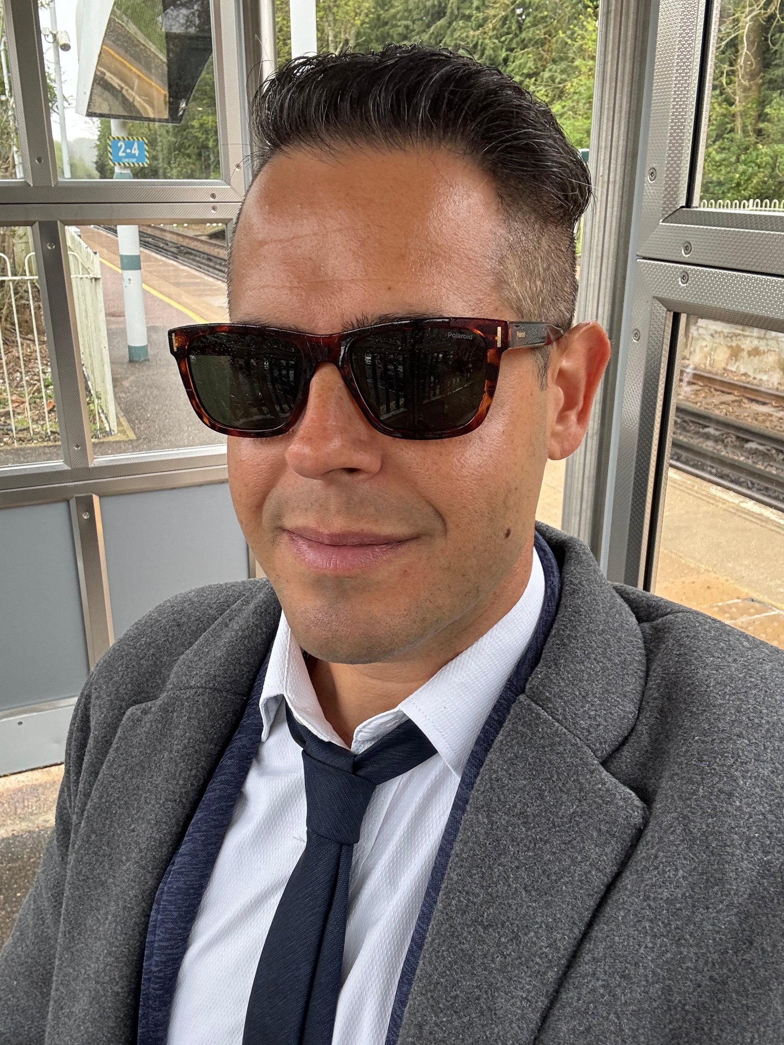 Jon Riesel in London, dressed for work at the railway station