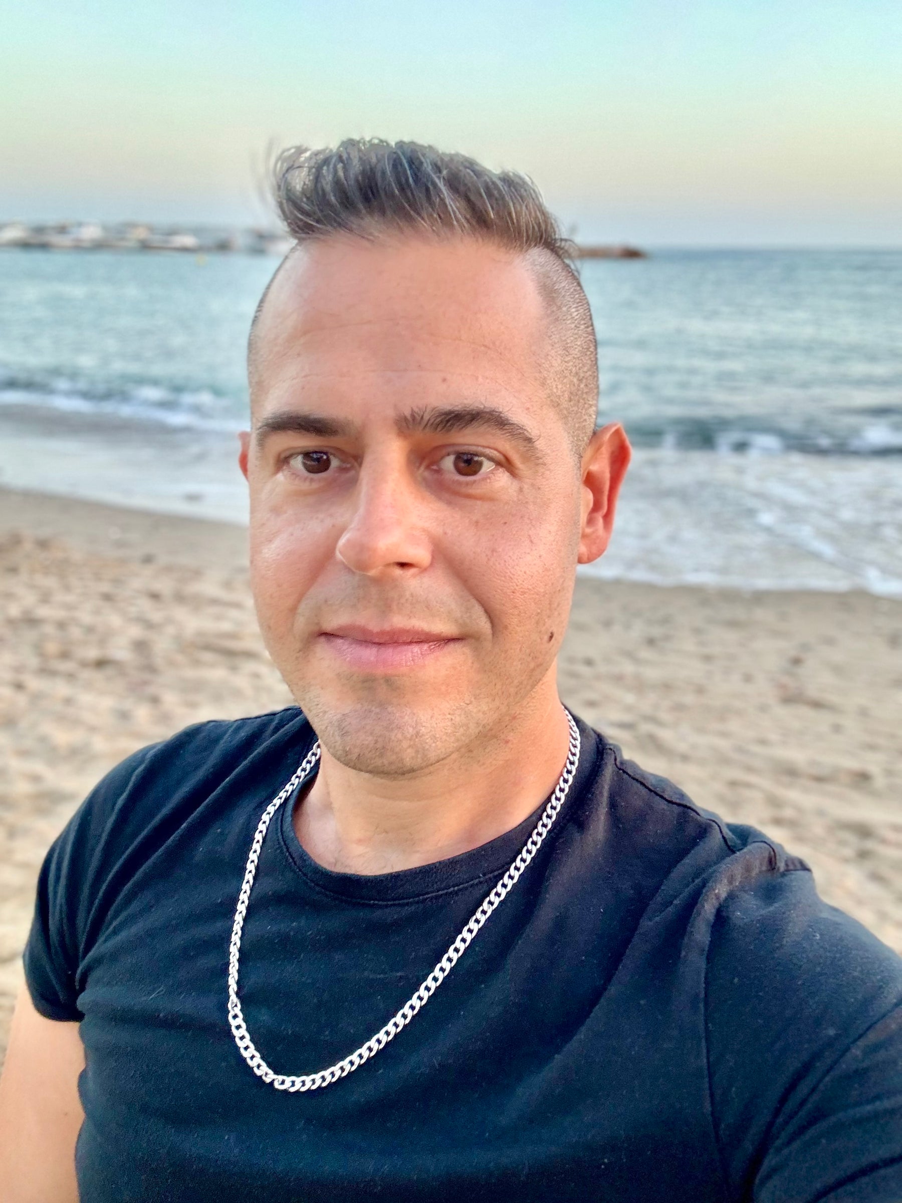Jon Riesel at Playa del Faro in a black shirt
